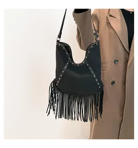 Stylish black Bohemian fringe tote bag with vintage metal studs and tassel decoration