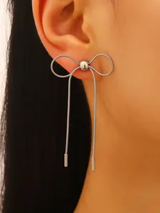 Detail view of high-quality stainless steel bow stud earring with long tassels