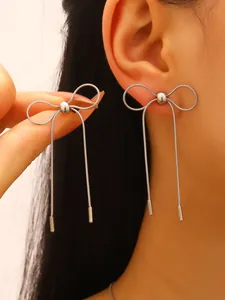 High-end silver stainless steel bow drop earrings with elegant snake chain tassels