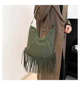 Bohemian style green suede shoulder bag with long fringe tassels and metal studs
