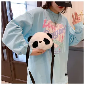 Cute panda-shaped plush crossbody bag worn as a lifestyle accessory.