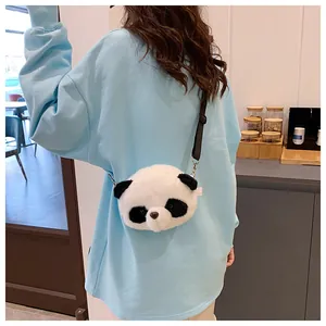 Detail shot of a girl wearing a cute panda-shaped plush crossbody bag from behind.