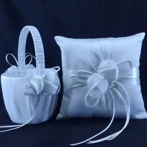 White satin wedding flower girl basket and ring bearer pillow with ribbon details