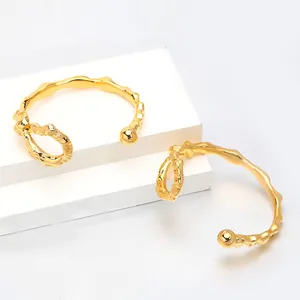Elegant 18K gold plated irregular open bracelet with unique knotted texture design