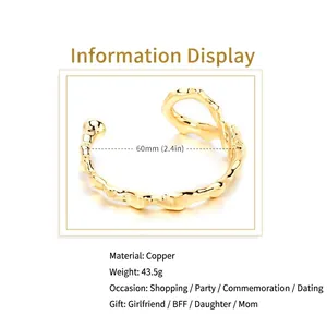 Irregular 18K gold plated open bangle with 60mm diameter and organic texture.
