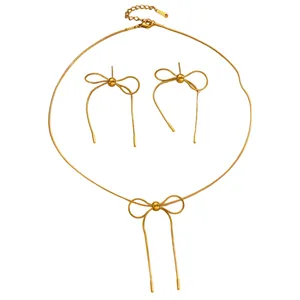 Gold stainless steel jewelry set featuring elegant bow-knot necklace and stud earrings