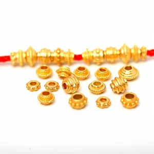 Detailed view of assorted textured S925 sterling silver gold-plated jewelry spacer beads