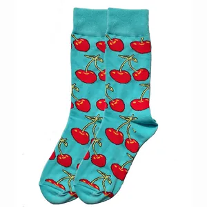 Vibrant turquoise cotton crew socks featuring a playful red cherry pattern print.
