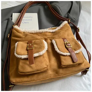 Vintage brown faux suede backpack with white fleece trim and gold buckles for winter