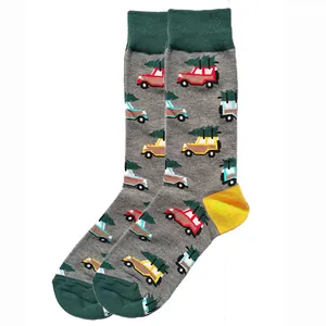 Detailed view of grey cotton socks with colorful cars and Christmas trees pattern