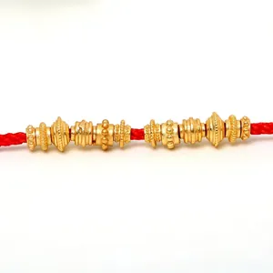 Detailed close-up of various gold-plated silver spacer beads for DIY jewelry making