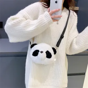 Cute panda-shaped plush crossbody bag worn by a model in a casual lifestyle mirror selfie