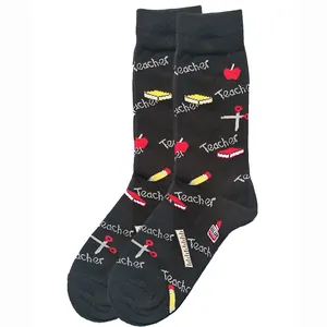 Detailed close-up shot of Teacher themed socks featuring apple and pencil patterns