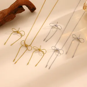 Elegant stainless steel bow necklace and earrings set in gold and silver finish
