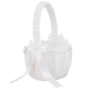 Elegant white satin wedding flower girl basket with decorative bow and lace details
