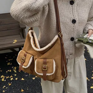 Stylish brown suede tote bag with white faux fur trim and vintage gold buckles.
