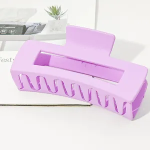 Detailed macro view of a large matte lavender rectangular hair claw clip for thick hair