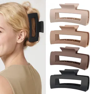 Large rectangular matte hair claw clips for thick hair shown on a blonde model
