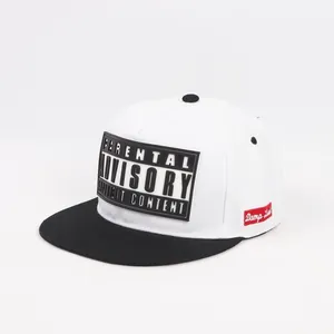 Detail of white hip-hop cap with black brim and Parental Advisory patch.