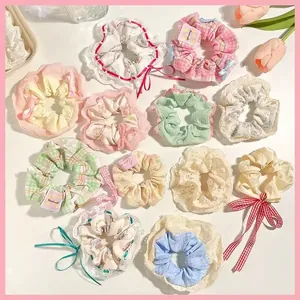 Assorted floral and plaid lace fabric scrunchies set for elegant hair styling accessory