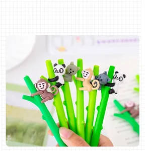 Close-up of cute panda and monkey cartoon gel pens with decorative green bamboo stems