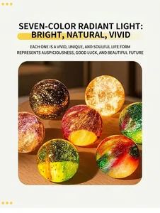 Close-up view showing multiple colorful glowing galaxy crystal balls on a wooden table
