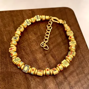 Vintage-Armband mit goldenen Mahjong-Steinen und chinesischen Schriftzeichen