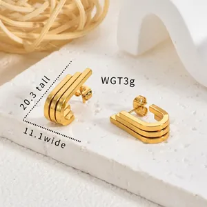 Detail view of vintage gold geometric stainless steel earrings with size and weight