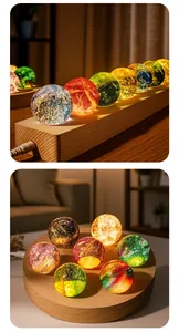 Beautiful detailed view of colorful starry crystal ball night lights on natural wooden bases