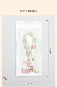 Detailed view of the hand-woven daisy floral cup strap in transparent packaging