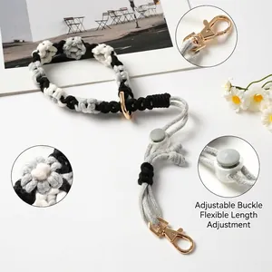 Handmade woven daisy cup lanyard with adjustable strap and golden lobster clasp.