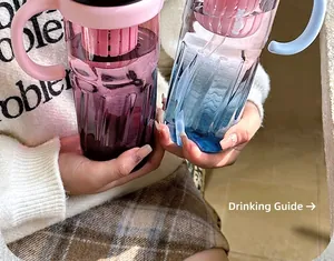 Close-up of gradient water bottle with integrated tea infuser and handle
