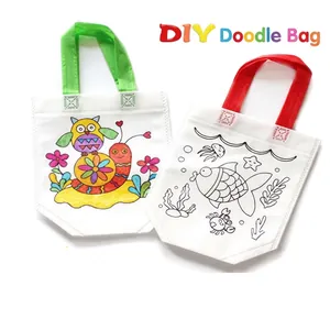 Close-up of DIY doodle bags for kids featuring owl and sea animal patterns