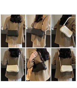Multi-angle views of a stylish women's underarm bag shown in classic black and white