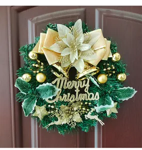 Vue détaillée d'une couronne de Noël de 30cm avec nœud doré et signe Merry Christmas