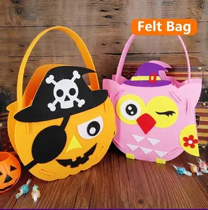 Detailed view of handmade Halloween felt candy bags featuring pirate pumpkin and owl designs