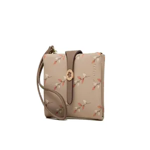 Side view showing elegant floral pattern and functional wristlet strap of the short wallet