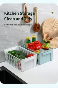 Plastic hollow rectangular storage baskets organizing vegetables and sauces in kitchen