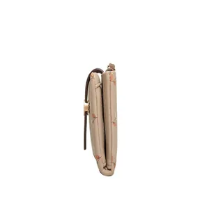 Detailed side view showing the thickness of a beige floral print women's wallet