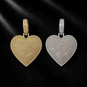 Detailed view of hip hop heart pendants with baguette CZ in gold and silver finishes.