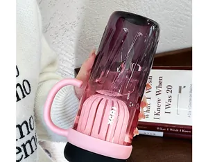 Detail of stylish gradient purple and pink water bottle with built-in tea separator
