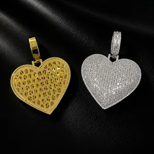 Detailed view of hip-hop heart pendants in gold and silver showing front and back
