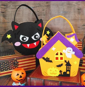Detail view of colorful Halloween felt gift bags in bat and haunted house shapes