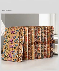 Collection of eco-friendly cork notebooks with Bohemian and butterfly prints.
