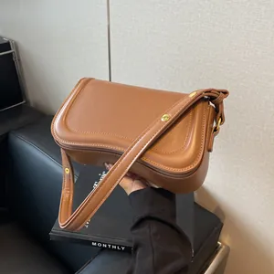 Minimalist brown faux leather baguette shoulder bag for women in Korean style