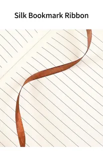 Close-up of the elegant brown silk ribbon bookmark in a retro cork notebook