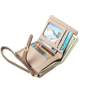 Elegant beige women's short bifold wallet with floral snap buckle and hand strap