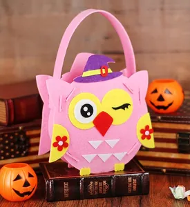 Detailed view of handmade pink owl felt Halloween candy bag featuring a purple wizard hat