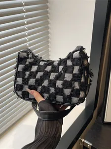 Trendy black and white checkered canvas shoulder bag with unique frayed fringe detail design