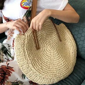 Handcrafted round straw shoulder bag with leather straps for beach summer fashion